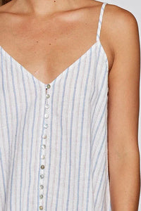 Woman wearing striped button front tank top, perfect for women’s boho chic clothing from Shop Daisy
