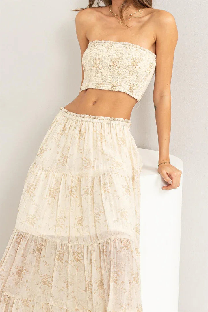 Woman in high-waisted bohemian skirt and trendy top from FLORAL TUBE TOP AND MAXI SKIRT product