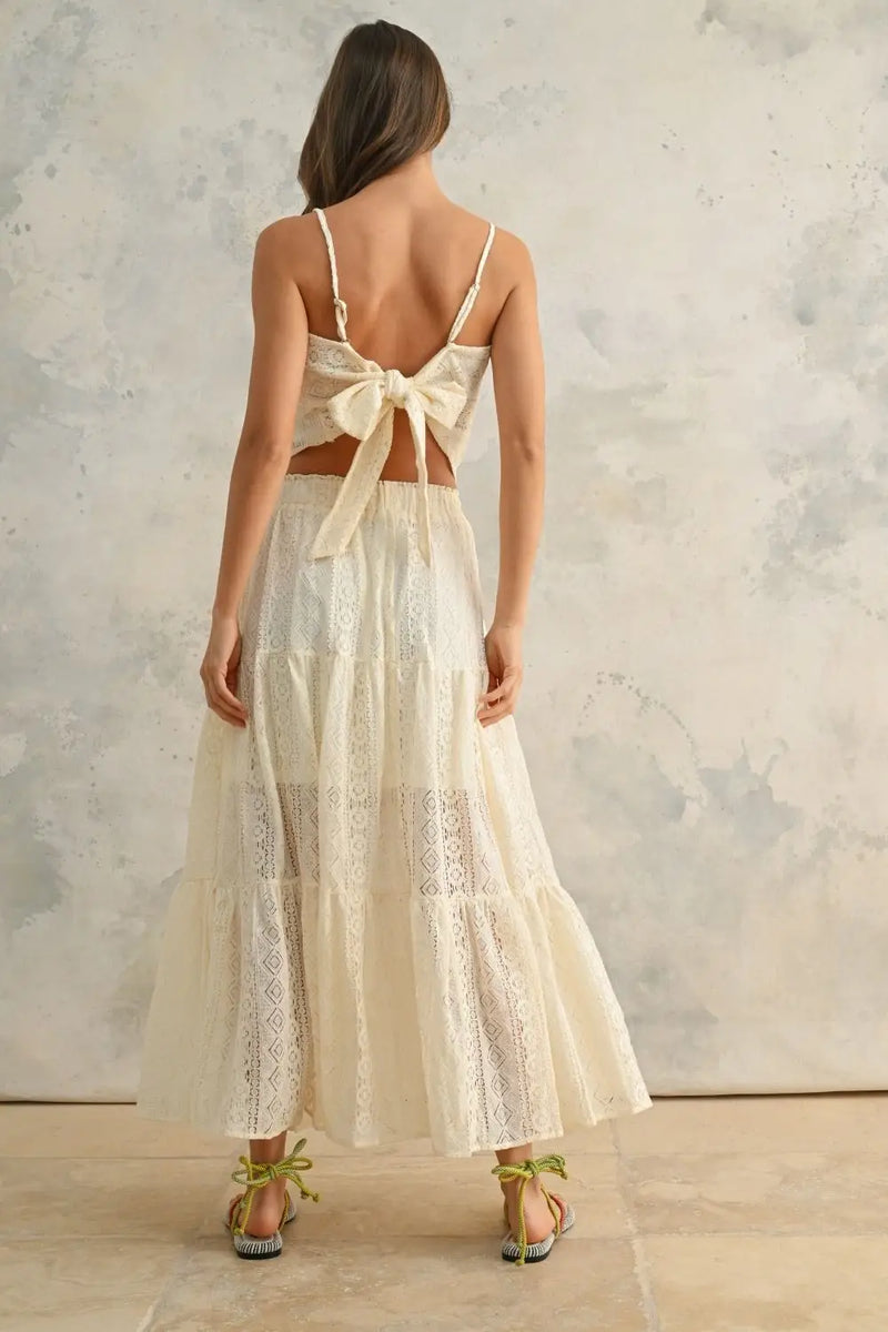 Woman in a white crochet lace tiered two-piece outfit showing BOHO ME Crochet Lace Tiered Skirt