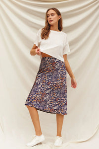 Woman in a flowy Floral A-Line Midi-Maxi Skirt, embodying boho free spirit style