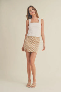 Woman in a white tank top and patterned beige skirt showcasing Mini Ribbed Squared Neck style