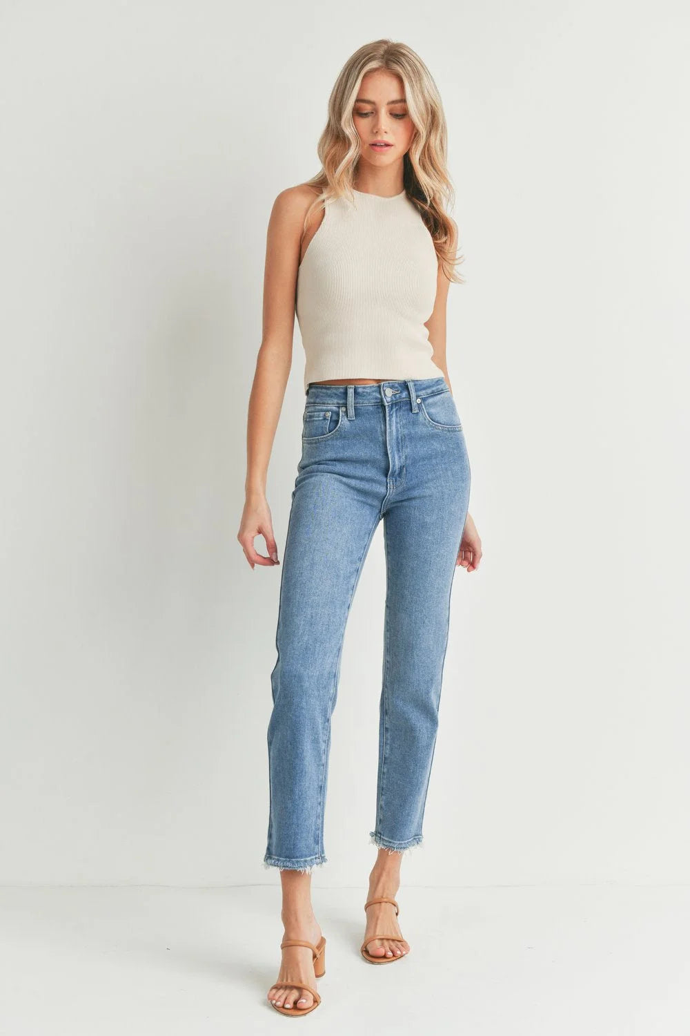 Woman in white tank top showcasing STRAIGHT WITH POCKET AND HEM BUST JEANS