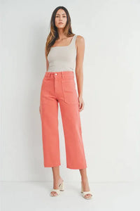 Woman in white tank top and pink pants featuring Nautical Wide Leg Denim style