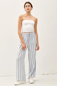 Woman wearing ombre striped wide-leg trousers with a drawstring waist