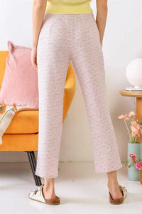 Woman in yellow top and pink pants showcasing Chamomile Print Two Pocket High Waist Pants