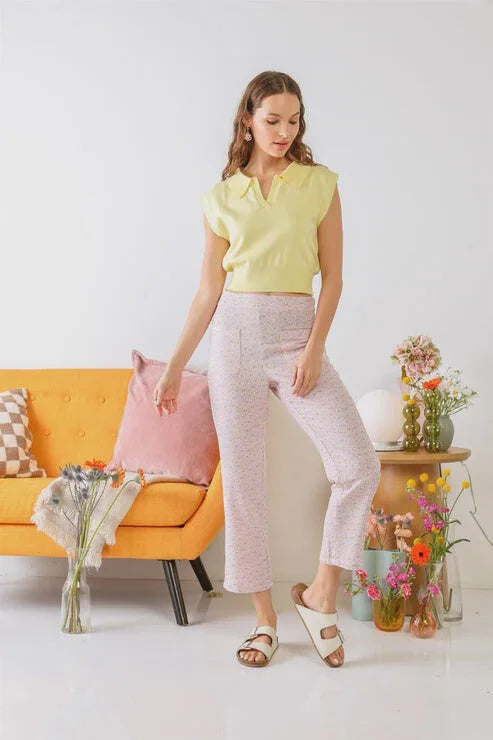 Woman in yellow top and pink pants featuring chamomile print high waist boho style