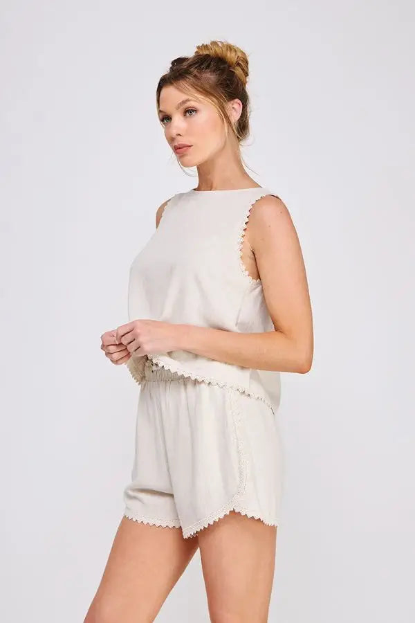 Elegant sleeveless tulip top and shorts set with crochet lace trim for effortless summer wear