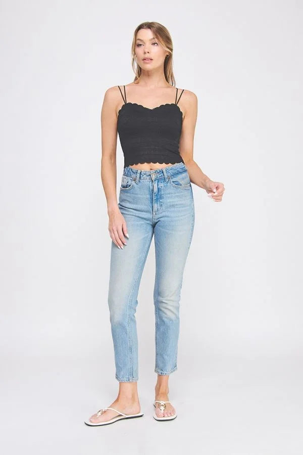 Woman wearing daisy lane’s scallop edge bralette with a whimsical trim, showcasing a flirty silhouette