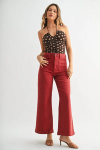 Woman wearing THE SAILOR POCKET WIDE LEG denim jeans with black halter top and patch pockets