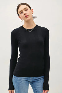 Woman wearing a black ribbed long-sleeve crew neck top in the BASIC PATTERNED KNIT SWEATER