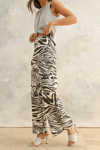 Woman wearing black and white zebra print stretch wide-leg pants, Zebra Print Stretch Pants