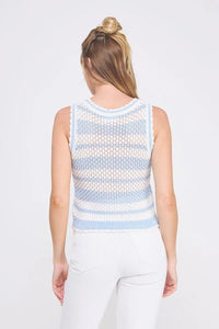 Woman wearing a blue and white striped crochet scallop edges knit tank top