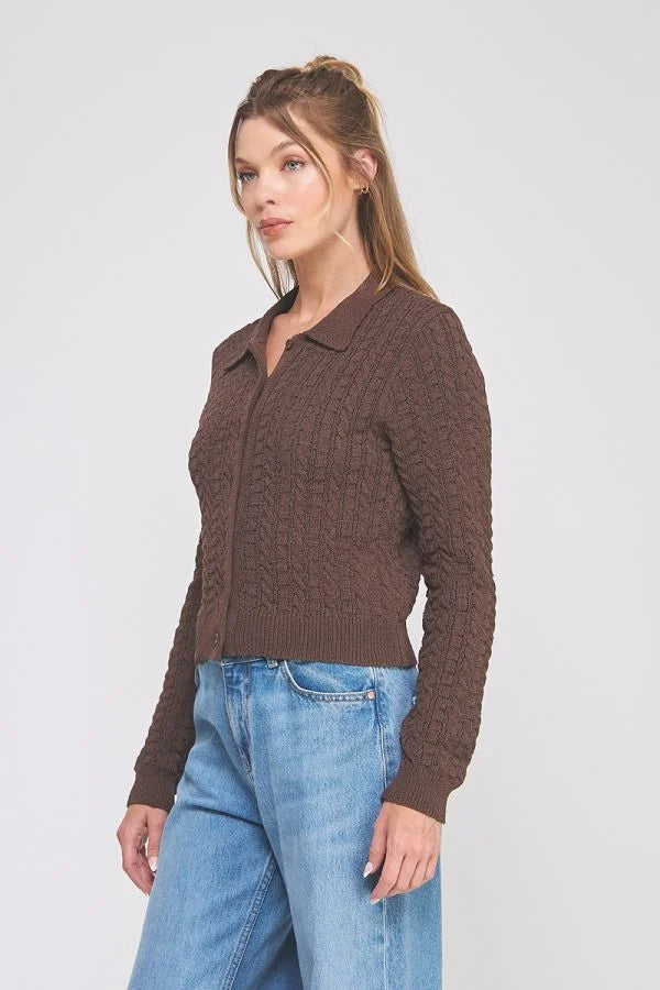 Woman wearing small cable knit button-down cardigan with long sleeves