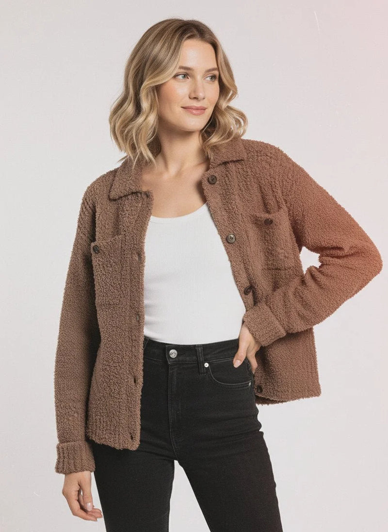 Woman wearing a brown fleece button-up Lois Sweater Jacket, a stylish sweater jacket option