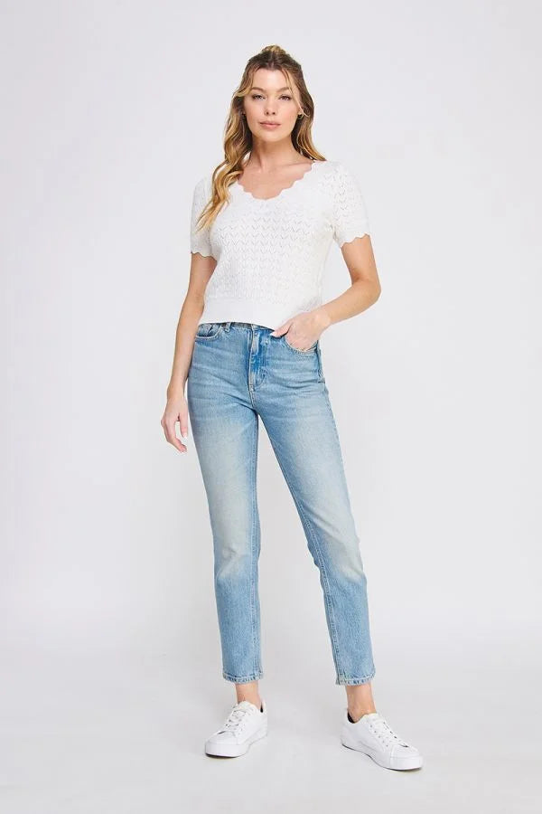 Woman’s casual outfit featuring POINTELLE V-NECK KNIT with scallop edges, ideal for boho chic clothing