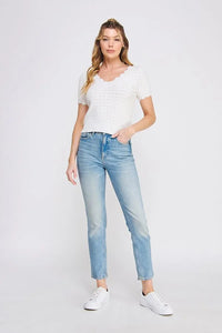 Woman’s casual outfit featuring POINTELLE V-NECK KNIT with scallop edges, ideal for boho chic clothing