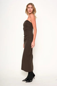 Woman wearing Lavene Strapless Maxi Dress with ruched bodice and side slit