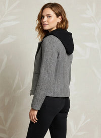 Woman wearing grey tweed Alejandra Coat with black hood from Supply Alejandra collection