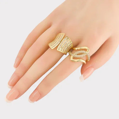 Woman’s hand wearing CZ Looped Ring with cubic zirconia centerpiece and triple gold plating