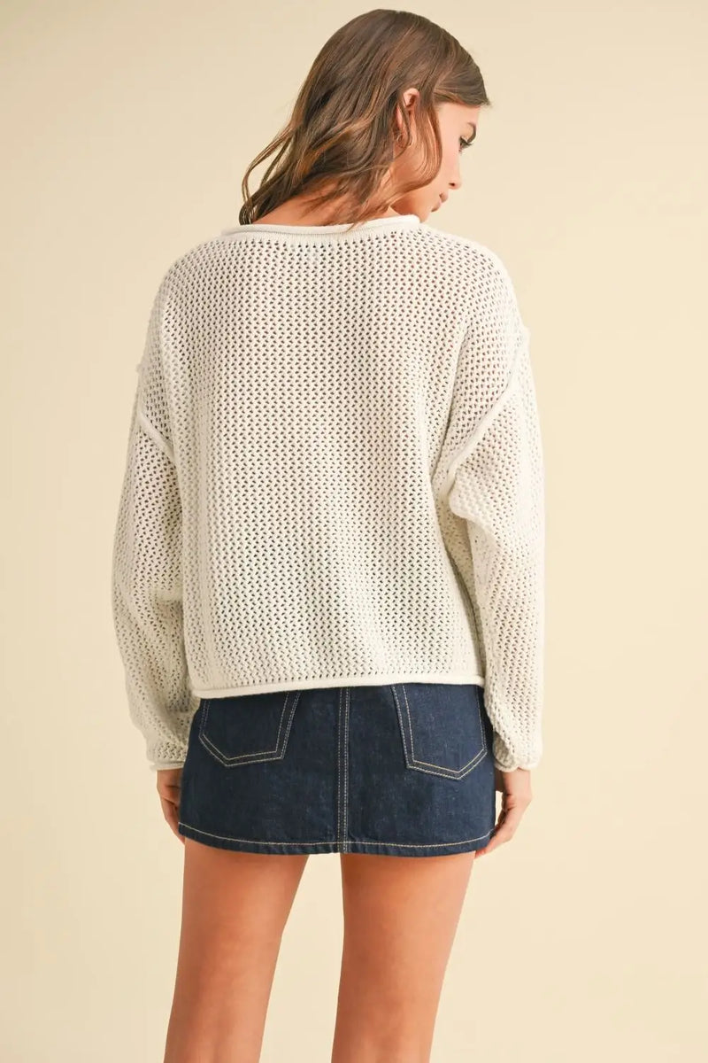 Flag women’s boho chic clothing style featuring a woman’s knit sweater top and denim skirt at Shop Daisy