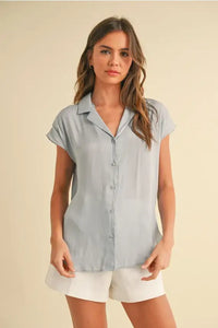 Light blue cap sleeve shirt for women, designed to be both stylish and flattering