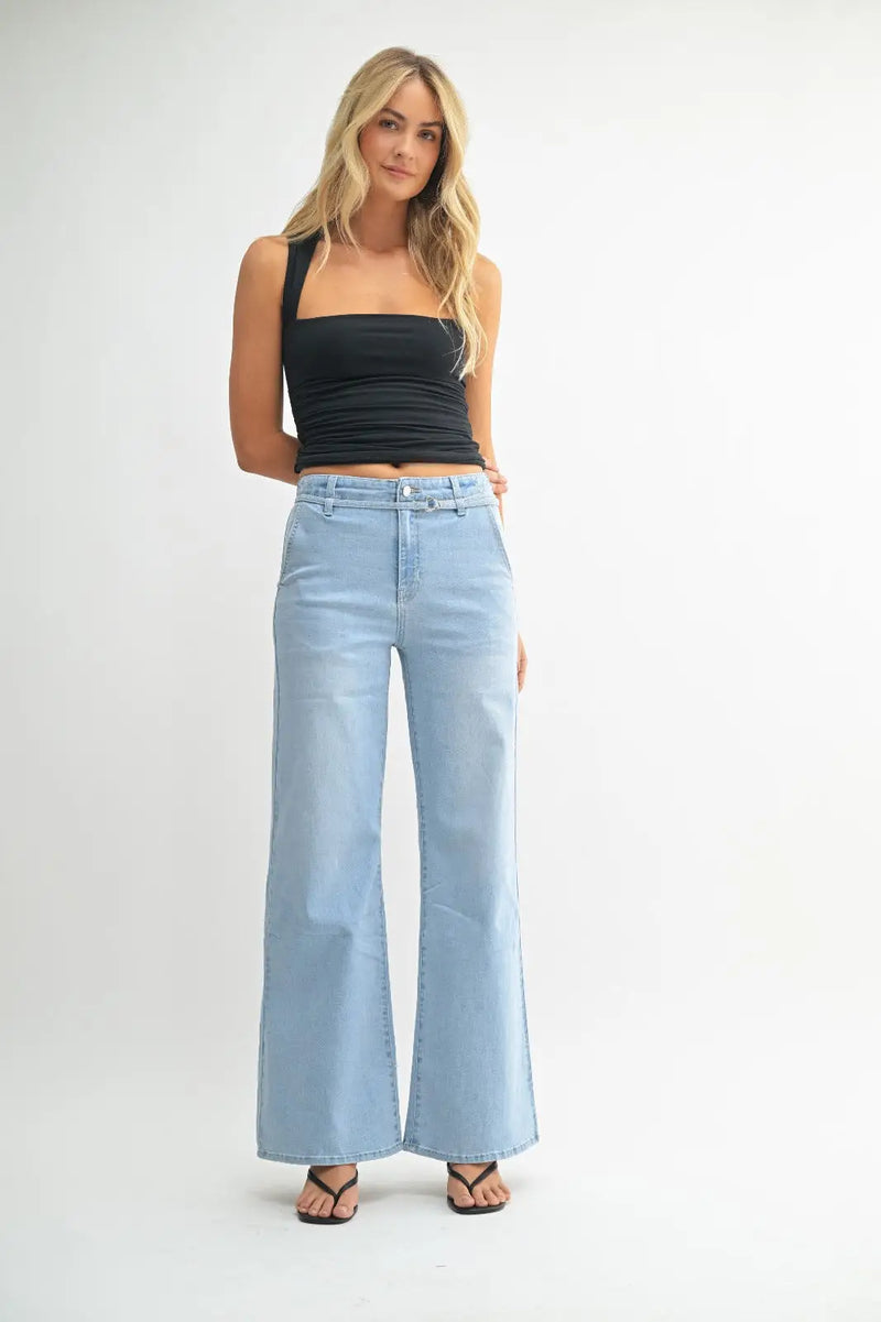 Woman wearing light blue denim belted wide leg jeans from JUST BLACK collection