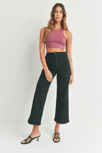 Woman wearing a mauve crop top with women’s boho chic sailor pocket wide leg jeans
