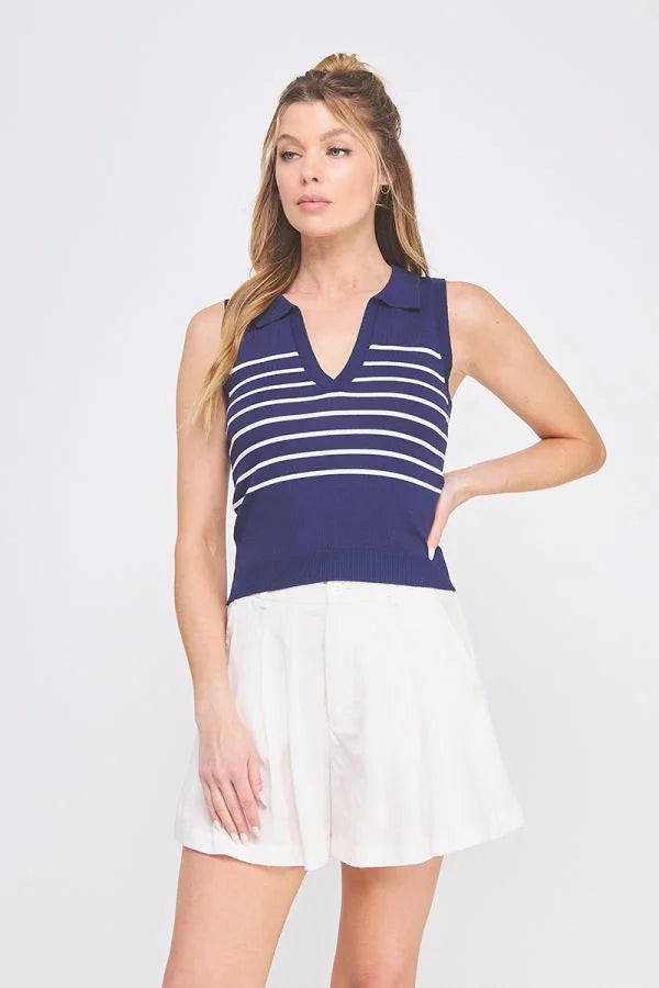 Woman wearing navy and white striped knit sleeveless polo tank top with V neck