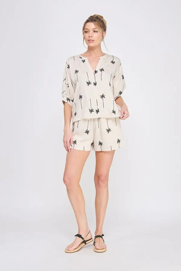 Woman’s palm tree print shorts set from shop Daisy, perfect for women’s boho chic clothing