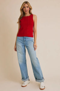 Woman wearing a red boat neck sleeveless botton ribbed top from Daisy Lane Shop