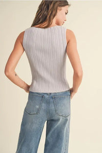 Ribbed knitted tank top paired with wide-leg jeans from Shop Daisy for women’s boho chic clothing