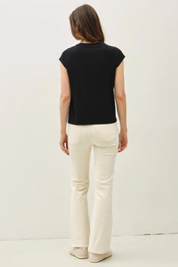 Bamboo cap sleeve basic round neck top worn with cream-colored flare pants