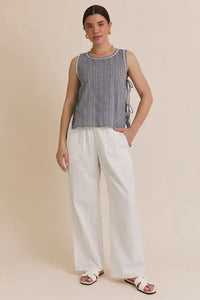 Woman’s round neck sleeveless gingham top with wide-leg pants outfit display