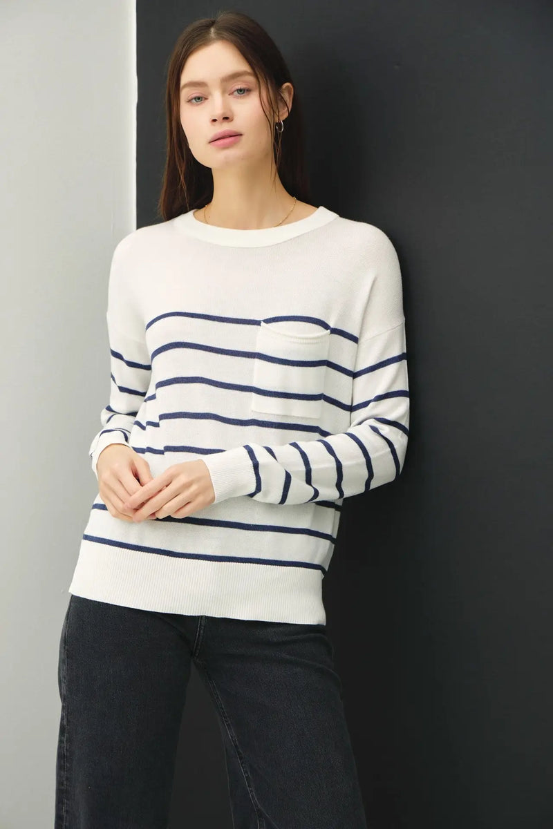 Woman wearing a lightweight striped sweater, ideal for casual and stylish wear