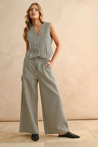 Woman wearing striped button sleeveless vest and matching wide-leg pants for women’s boho chic clothing at Shop Daisy
