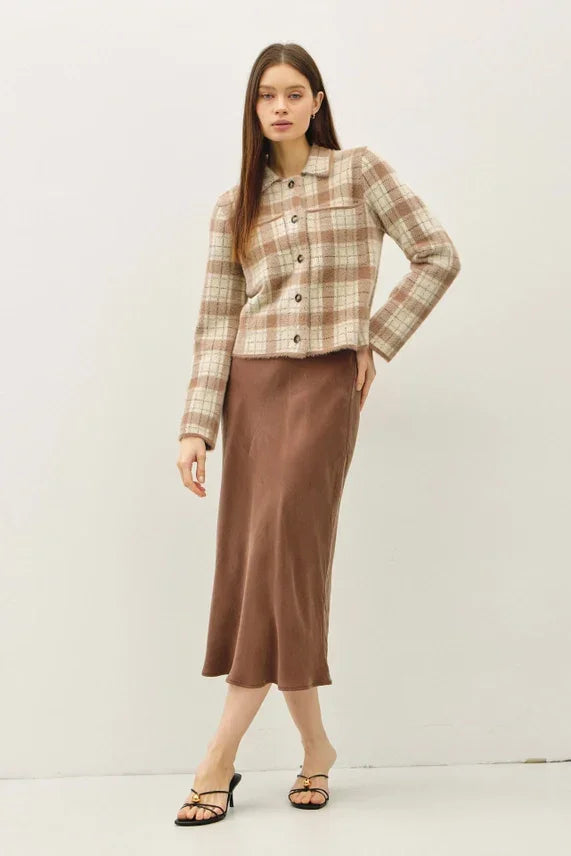 Fuzzy plaid collared crop cardigan featuring a beige and brown plaid button-up shirt and brown satin midi skirt