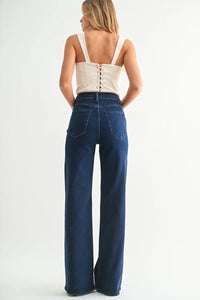 Women’s beige corset top with high rise wide leg palazzo jeans for a stylish look