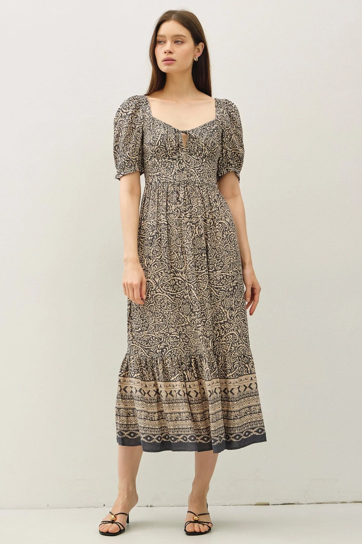 Women’s black and beige paisley border print midi dress with puff sleeves and ruffled hem