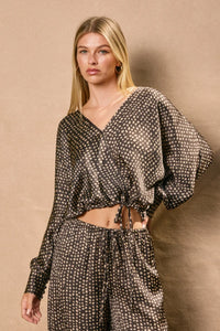 Women’s black and beige polka dot satin sand surplice crop top with matching wide-leg pants for women’s boho chic clothing from Shop Daisy