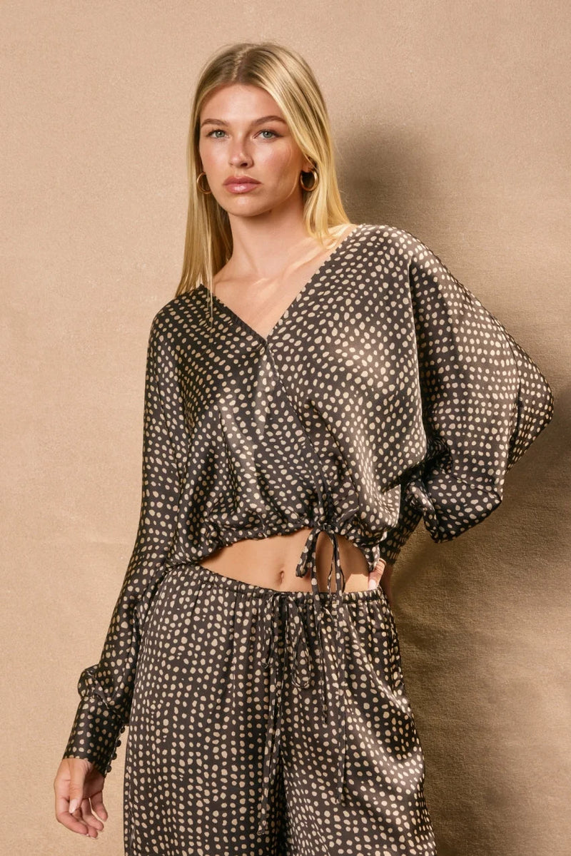 Women’s black and beige polka dot satin sand surplice crop top with matching wide-leg pants for women’s boho chic clothing from Shop Daisy