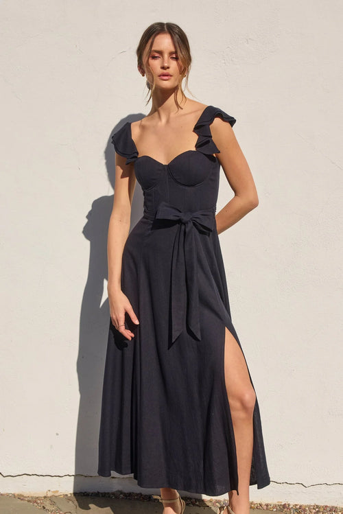 Women’s black corset flutter dress with ruffled straps, sweetheart neckline, and thigh-high slit