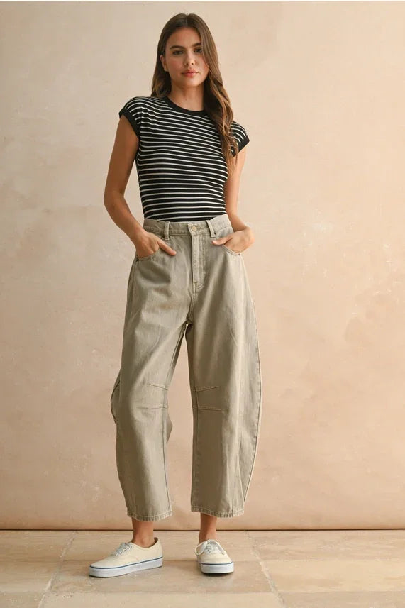 Women’s black and white striped short-sleeve shirt paired with Barrel Cotton Pants for a stylish look