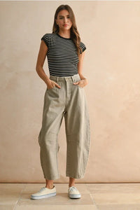 Women’s black and white striped short-sleeve shirt paired with Barrel Cotton Pants for a stylish look