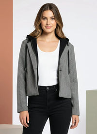 Women’s black and white herringbone hooded jacket from the Supply Alejandra Coat collection