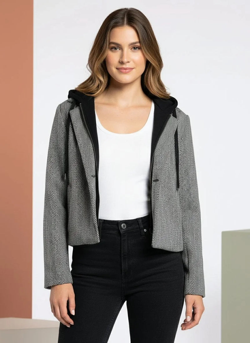 Women’s black and white herringbone hooded jacket from the Supply Alejandra Coat collection