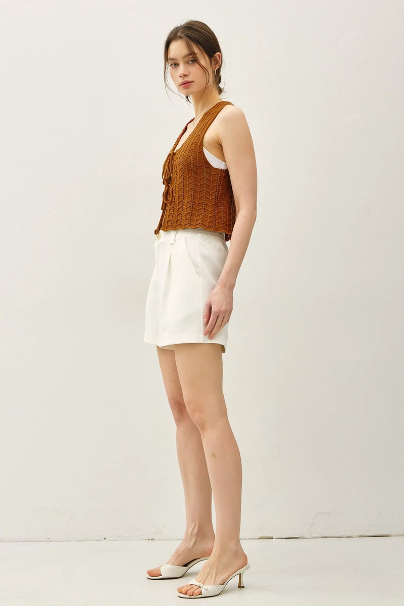 Women’s WAVY KNIT TIE FASTENING VEST with white shorts and heeled mules