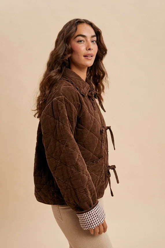 Women’s garment washed quilted corduroy jacket with toggle closures and checkered cuffs