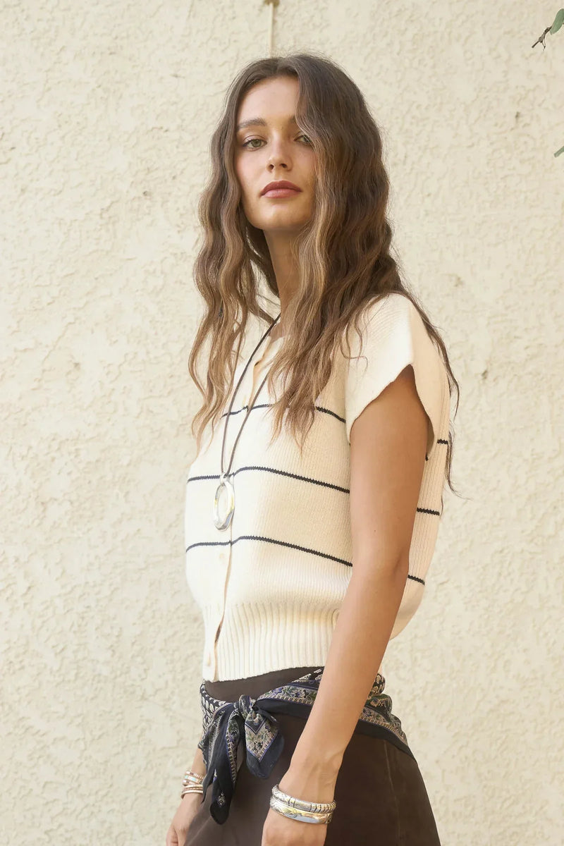 Women’s cream and black striped short sleeve knit cardigan displayed in a stylish short sleeve knit