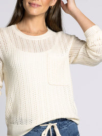 Women’s cream-colored open-knit Supply Joan Sweater with chest pocket and long sleeves