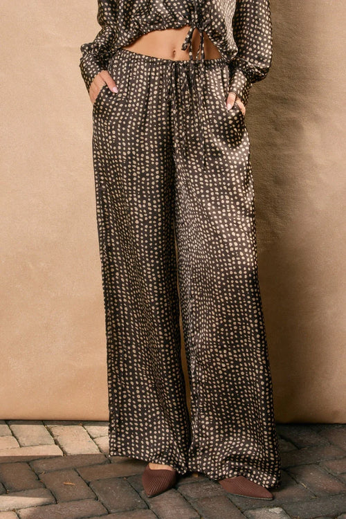 Women’s dark brown patterned sand pull drawstring pants with a relaxed fit
